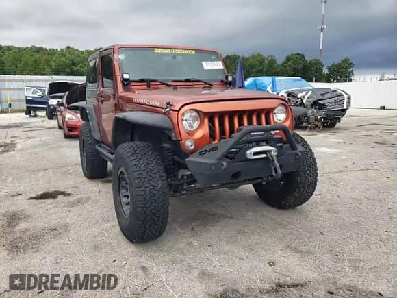 2014 Jeep Wrangler Rubicon with VIN 1C4BJWCG2EL303420, listed as a Copart auction lot 63550985 with 87,175 mi miles and Salvage title. Bid and sale history available at DreamBid. Image 14.