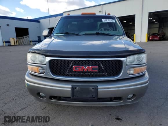 2002 GMC Sierra 1500 Denali z VIN 2GTFK69U021173036, wystawiony jako Copart lot #51416215 z przebiegiem 316 034 mil mil oraz Szkoda całkowita • Salvage title. Historia ofert i sprzedaży dostępna na DreamBid. Obrazek 5.