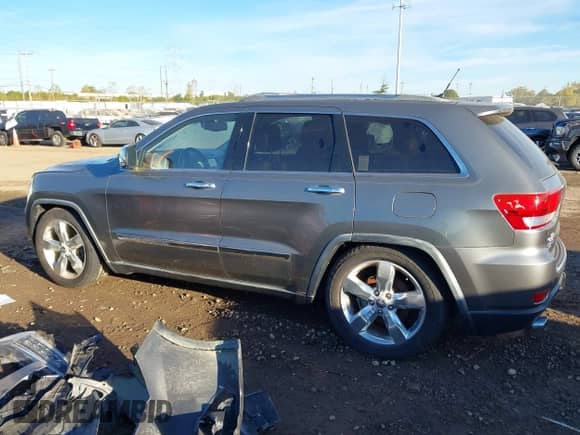 2012 Jeep Grand Cherokee Overland Summit z VIN 1C4RJFCT4CC214957, wystawiony jako IAAI lot #43468380 z przebiegiem 137 539 mil mil oraz . Historia ofert i sprzedaży dostępna na DreamBid. Obrazek 14.