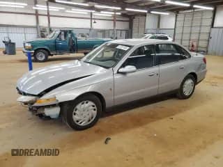 2000 Saturn LS with VIN 1G8JU52FXYY701319, listed as a Copart auction lot 47231185 with 158,327 mi miles and Salvage title. Bid and sale history available at DreamBid. Image 1.