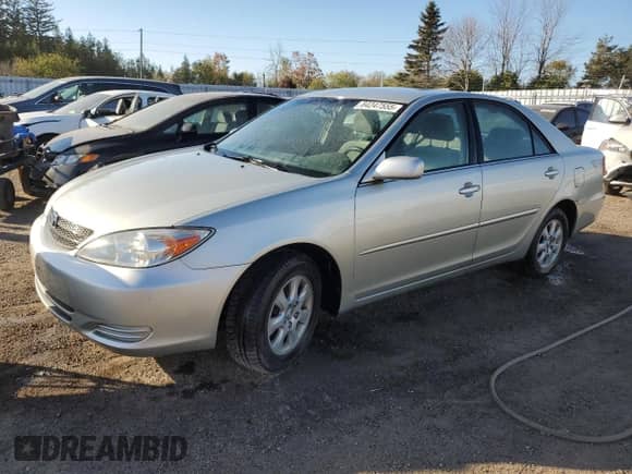 2002 Toyota Camry XLE with VIN JTDBF32KX20054853, listed as a Copart auction lot 84247555 with 176,850 mi miles and Clean title. Bid and sale history available at DreamBid. Image 1.