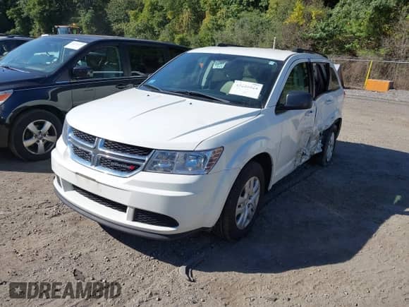 2014 Dodge Journey SE with VIN 3C4PDDAG4ET176145, listed as a IAAI auction lot 43226524 with 97,488 mi miles and . Bid and sale history available at DreamBid. Image 2.