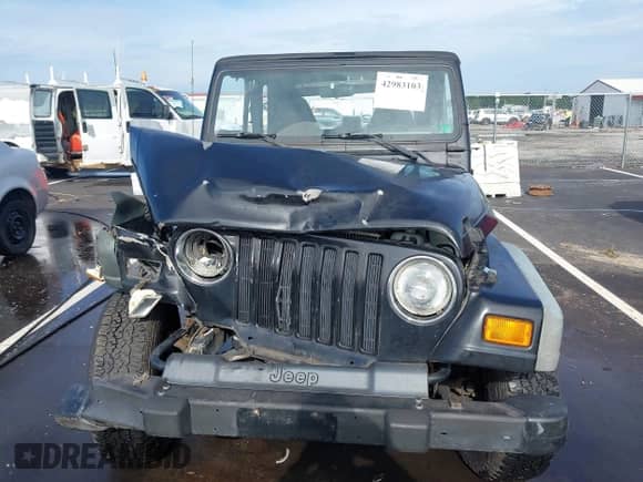 2000 Jeep Wrangler Sport z VIN 1J4FA49S8YP755297, wystawiony jako IAAI lot #42983103 z przebiegiem 181 036 mil mil oraz . Historia ofert i sprzedaży dostępna na DreamBid. Obrazek 12.