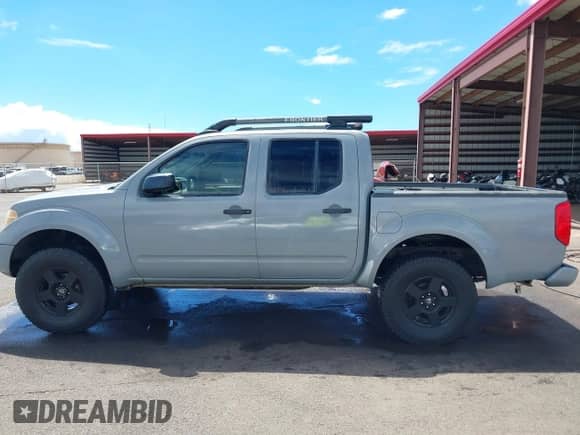 2007 Nissan Frontier LE with VIN 1N6AD07W17C438647, listed as a IAAI auction lot 40502289 with 153,553 mi miles and . Bid and sale history available at DreamBid. Image 14.