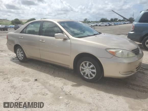 2002 Toyota Camry XLE z VIN 4T1BE32K32U522526, wystawiony jako Copart lot #85570695 z przebiegiem 119 936 mil mil oraz Czysty tytuł • Clean title. Historia ofert i sprzedaży dostępna na DreamBid. Obrazek 4.