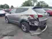 2018 Hyundai Santa Fe 2.4L z VIN 5XYZTDLB4JG526856, wystawiony jako IAAI lot #42998185 z przebiegiem 106 919 mil mil oraz . Historia ofert i sprzedaży dostępna na DreamBid. Obrazek 3.