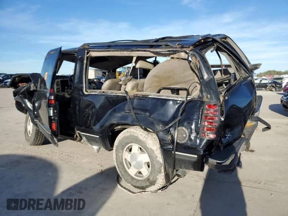 1995 Chevrolet Tahoe z VIN 3GNEK18K0SG103792, wystawiony jako Copart lot #80339604 z przebiegiem 356 496 mil mil oraz Szkoda całkowita • Salvage title. Historia ofert i sprzedaży dostępna na DreamBid. Obrazek 2.