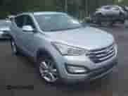 2014 Hyundai Santa Fe z VIN 5XYZU3LA9EG195437, wystawiony jako IAAI lot #43318157 z przebiegiem 82 644 mil mil oraz . Historia ofert i sprzedaży dostępna na DreamBid. Obrazek 1.