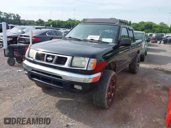 2000 Nissan Frontier XE with VIN 1N6ED27Y3YC413619, listed as a IAAI auction lot 42468394 with 272,116 mi miles and . Bid and sale history available at DreamBid. Image 2.