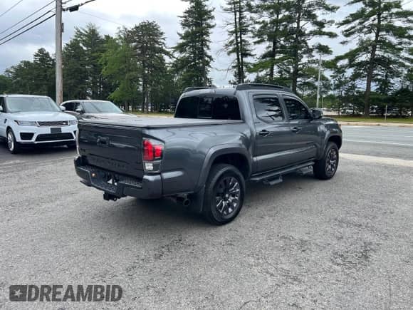 2022 Toyota Tacoma Limited с VIN 3TMGZ5AN7NM458988, выставлен на аукционе Copart как лот 65398105 с пробегом 32 115 миль миль и Списание • Salvage title. История ставок и продаж доступна на DreamBid. Изображение 4.