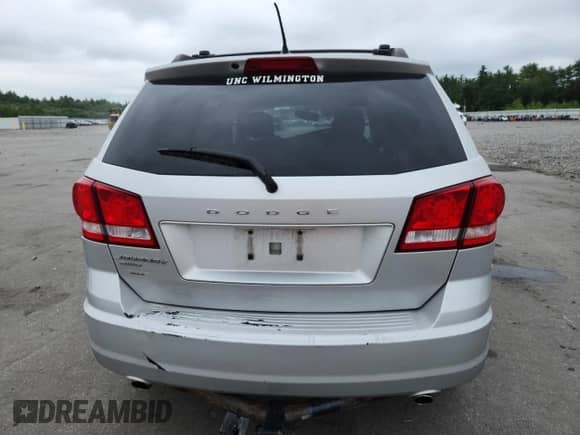 2014 Dodge Journey SE with VIN 3C4PDDAG0ET284651, listed as a Copart auction lot 64187145 with 182,485 mi miles and Salvage title. Bid and sale history available at DreamBid. Image 6.