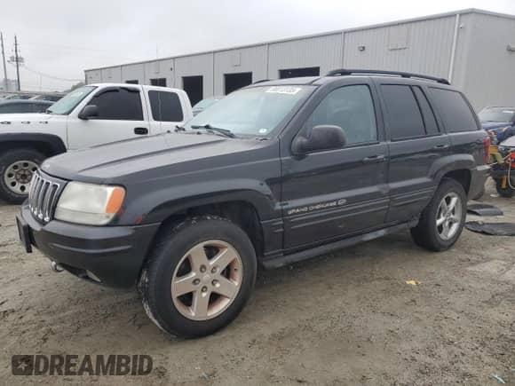 2002 Jeep Grand Cherokee Overland with VIN 1J8GW68JX2C290531, listed as a Copart auction lot 90013135 with 169,552 mi miles and Salvage title. Bid and sale history available at DreamBid. Image 1.