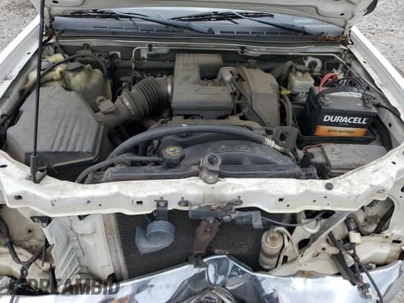 2005 Chevrolet Colorado z VIN 1GBDS146758251871, wystawiony jako Copart lot #70482905 z przebiegiem 287 082 mil mil oraz Szkoda całkowita • Salvage title. Historia ofert i sprzedaży dostępna na DreamBid. Obrazek 11.