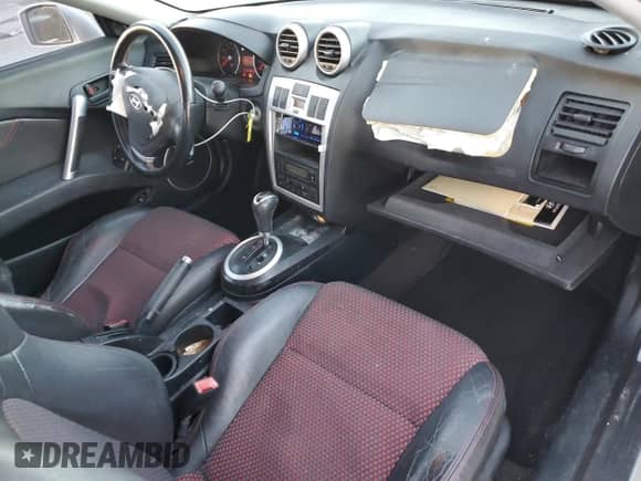 2005 Hyundai Tiburon GT с VIN KMHHN65F05U171038, выставлен на аукционе Copart как лот 87765735 с пробегом 113 129 миль миль и Списание • Salvage title. История ставок и продаж доступна на DreamBid. Изображение 8.