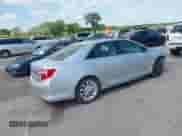 2014 Toyota Camry LE z VIN 4T1BD1FKXEU097389, wystawiony jako IAAI lot #42758735 z przebiegiem 162 617 mil mil oraz . Historia ofert i sprzedaży dostępna na DreamBid. Obrazek 4.