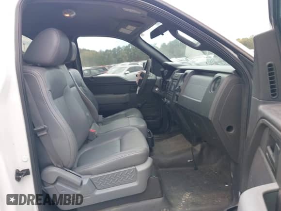 2014 Ford F-150 XL with VIN 1FTMF1CM7EFB62801, listed as a IAAI auction lot 43323235 with 186,000 mi miles and . Bid and sale history available at DreamBid. Image 5.
