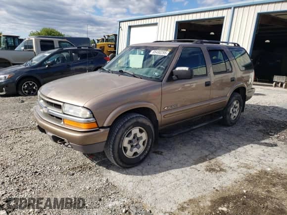 2003 Chevrolet Blazer LS with VIN 1GNDT13X93K149465, listed as a Copart auction lot 85490295 with 249,492 mi miles and Salvage title. Bid and sale history available at DreamBid. Image 1.