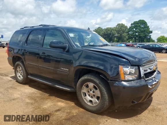 2014 Chevrolet Tahoe LT with VIN 1GNSCBE0XER118569, listed as a Copart auction lot 64116525 with 162,561 mi miles and Salvage title. Bid and sale history available at DreamBid. Image 4.