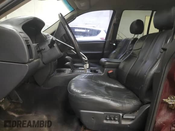 2002 Jeep Grand Cherokee Sport with VIN 1J4GW38S52C272382, listed as a Copart auction lot 65164915 with 248,964 mi miles and Clean title. Bid and sale history available at DreamBid. Image 7.