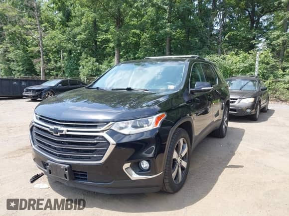 2018 Chevrolet Traverse LT with VIN 1GNEVHKW9JJ280947, listed as a IAAI auction lot 42582520 with 98,531 mi miles and . Bid and sale history available at DreamBid. Image 2.