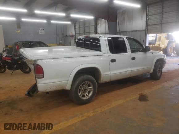2004 Dodge Dakota Sport z VIN 1D7HL38NX4S579316, wystawiony jako Copart lot #68731865 z przebiegiem 183 085 mil mil oraz Szkoda całkowita • Salvage title. Historia ofert i sprzedaży dostępna na DreamBid. Obrazek 3.