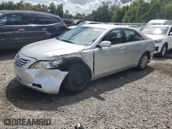 2007 Toyota Camry LE with VIN 4T1BK46K97U555689, listed as a Copart auction lot 71016945 with 213,560 mi miles and Salvage title. Bid and sale history available at DreamBid. Image 1.