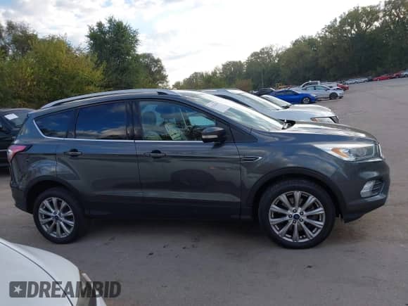 2017 Ford Escape Titanium z VIN 1FMCU9JD1HUD83745, wystawiony jako IAAI lot #43423010 z przebiegiem 257 150 mil mil oraz . Historia ofert i sprzedaży dostępna na DreamBid. Obrazek 13.