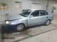 2005 Hyundai Accent GLS z VIN KMHCG45C65U662633, wystawiony jako Copart lot #86432595 z przebiegiem 221 608 mil mil oraz Szkoda całkowita • Salvage title. Historia ofert i sprzedaży dostępna na DreamBid. Obrazek 1.