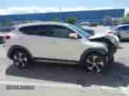 2018 Hyundai Tucson Sport with VIN KM8J33AL3JU802103, listed as a IAAI auction lot 41949054 with 96,922 mi miles and . Bid and sale history available at DreamBid. Image 14.