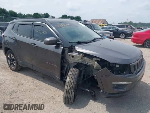 2018 Jeep Compass Trailhawk z VIN 3C4NJDDBXJT198919, wystawiony jako IAAI lot #42685470 z przebiegiem 139 764 mil mil oraz . Historia ofert i sprzedaży dostępna na DreamBid. Obrazek 1.