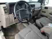 2003 Jeep Wrangler Sahara с VIN 1J4FA59S13P312830, выставлен на аукционе Copart как лот 52730955 с пробегом 99 247 миль миль и Списание • Salvage title. История ставок и продаж доступна на DreamBid. Изображение 8.