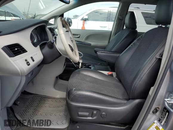 2014 Toyota Sienna SE with VIN 5TDXK3DC0ES412437, listed as a Copart auction lot 70558525 with 145,488 mi miles and Salvage title. Bid and sale history available at DreamBid. Image 7.