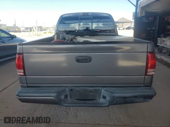2001 Dodge Dakota Sport with VIN 1B7HL2AN21S298590, listed as a Copart auction lot 54430385 with 175,365 mi miles and Salvage title. Bid and sale history available at DreamBid. Image 6.