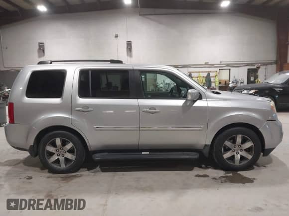 2012 Honda Pilot Touring with VIN 5FNYF4H90CB034523, listed as a IAAI auction lot 43540902 with 269,702 mi miles and . Bid and sale history available at DreamBid. Image 13.