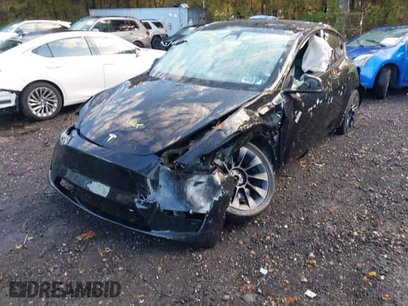 2023 Tesla Model Y Long Range with VIN 7SAYGAEE1PF914992, listed as a IAAI auction lot 43515980 with 5,543 mi miles and . Bid and sale history available at DreamBid. Image 6.