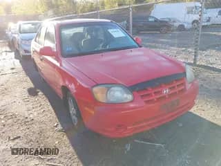 2005 Hyundai Accent GLS z VIN KMHCG45CX5U608980, wystawiony jako IAAI lot #43440401 z przebiegiem 137 550 mil mil oraz . Historia ofert i sprzedaży dostępna na DreamBid. Obrazek 1.