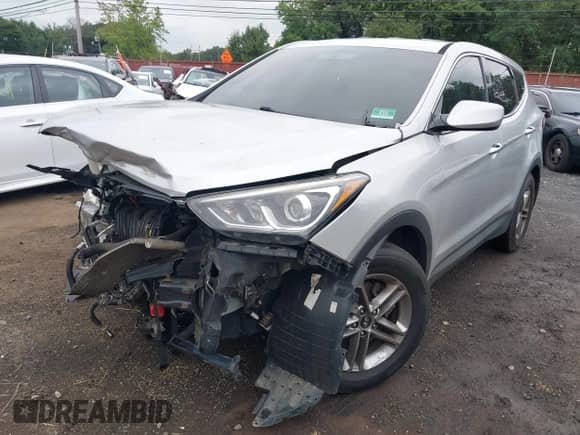 2018 Hyundai Santa Fe 2.4L z VIN 5XYZTDLB1JG530735, wystawiony jako IAAI lot #42893469 z przebiegiem 143 883 mil mil oraz . Historia ofert i sprzedaży dostępna na DreamBid. Obrazek 6.