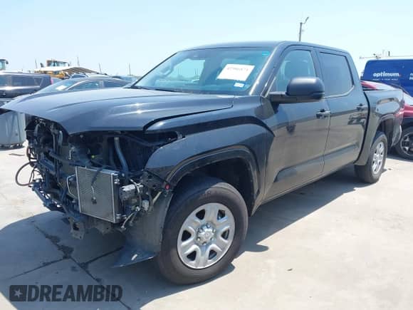 2022 Toyota Tundra SR with VIN 5TFKB5AB7NX017988, listed as a IAAI auction lot 42986871 with 50,437 mi miles and . Bid and sale history available at DreamBid. Image 2.