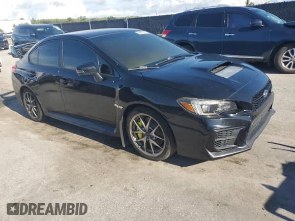 2020 Subaru WRX STI with VIN JF1VA2E61L9804518, listed as a Copart auction lot 69871235 with 93,292 mi miles and Salvage title. Bid and sale history available at DreamBid. Image 4.