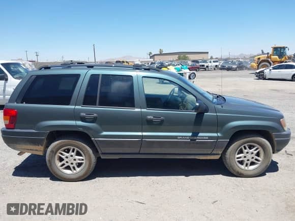 2003 Jeep Grand Cherokee Laredo z VIN 1J4GX48S03C609724, wystawiony jako IAAI lot #42783828 z przebiegiem 226 965 mil mil oraz . Historia ofert i sprzedaży dostępna na DreamBid. Obrazek 13.