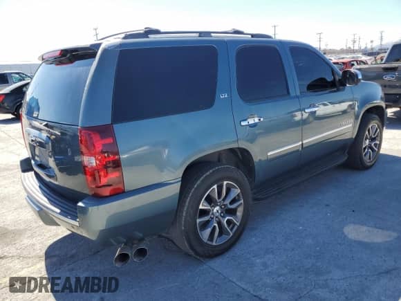 2009 Chevrolet Tahoe LTZ with VIN 1GNFC33J69R101907, listed as a Copart auction lot 71886395 with 246,080 mi miles and Salvage title. Bid and sale history available at DreamBid. Image 3.