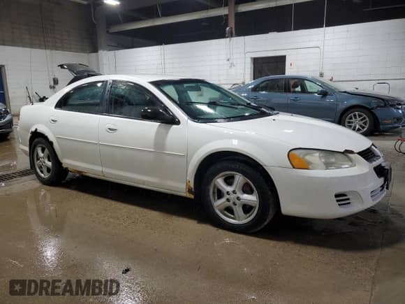 2006 Dodge Stratus SXT with VIN 1B3EL46R36N180291, listed as a Copart auction lot 77417464 with 182,971 mi miles and Salvage title. Bid and sale history available at DreamBid. Image 4.
