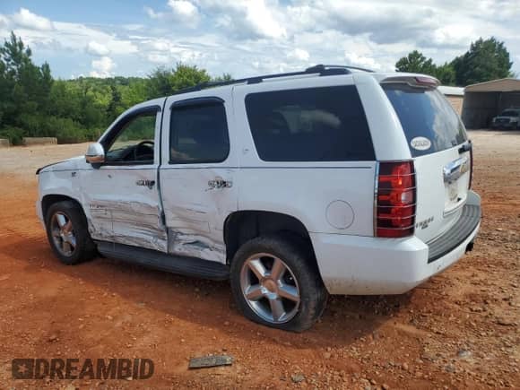 2012 Chevrolet Tahoe LT with VIN 1GNSCBE06CR119764, listed as a Copart auction lot 64947715 with 236,981 mi miles and Salvage title. Bid and sale history available at DreamBid. Image 2.