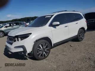 2022 Honda Pilot Touring 7-Passenger z VIN 5FNYF6H62NB007148, wystawiony jako Copart lot #69777725 z przebiegiem 54 748 mil mil oraz Szkoda całkowita • Salvage title. Historia ofert i sprzedaży dostępna na DreamBid. Obrazek 1.