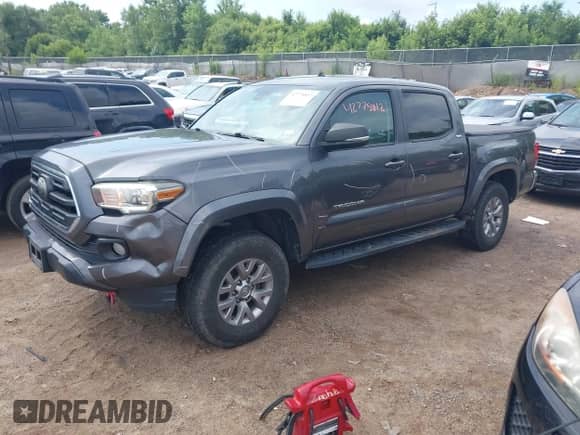 2018 Toyota Tacoma SR5 with VIN 5TFAZ5CN2JX061728, listed as a IAAI auction lot 42775812 with 119,408 mi miles and . Bid and sale history available at DreamBid. Image 2.