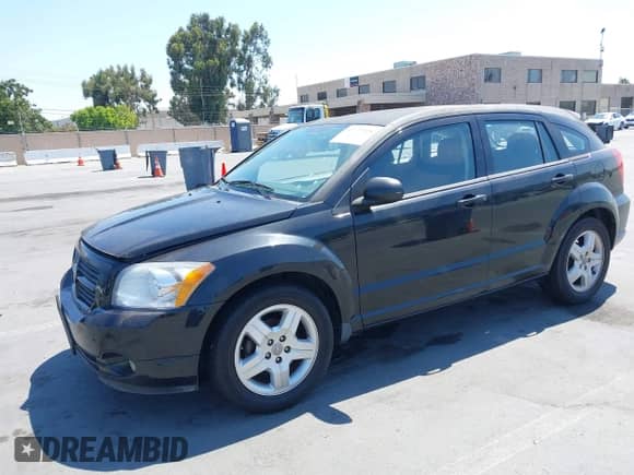 2009 Dodge Caliber SXT with VIN 1B3HB48C29D187901, listed as a IAAI auction lot 42727025 with 112,799 mi miles and . Bid and sale history available at DreamBid. Image 2.