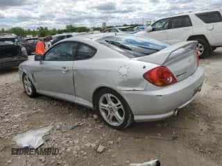 2004 Hyundai Tiburon GT с VIN KMHHN65F54U112744, выставлен на аукционе Copart как лот 57850495 с пробегом 103 409 миль миль и Списание • Salvage title. История ставок и продаж доступна на DreamBid. Изображение 2.
