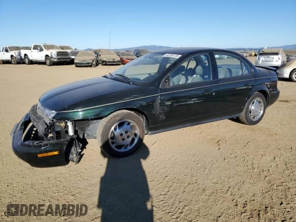 1996 Saturn SL with VIN 1G8ZK527XTZ335205, listed as a Copart auction lot 42230735 with 82,344 mi miles and Salvage title. Bid and sale history available at DreamBid. Image 1.