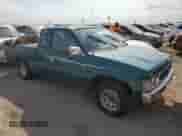 1995 Nissan Frontier XE with VIN 1N6HD16S3SC463075, listed as a Copart auction lot 76235934 with 122,466 mi miles and Salvage title. Bid and sale history available at DreamBid. Image 4.