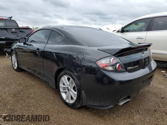 2008 Hyundai Tiburon GS with VIN KMHHM66D38U295048, listed as a Copart auction lot 69190834 with 88,219 mi miles and Salvage title. Bid and sale history available at DreamBid. Image 2.